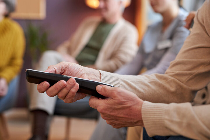 old person with remote control