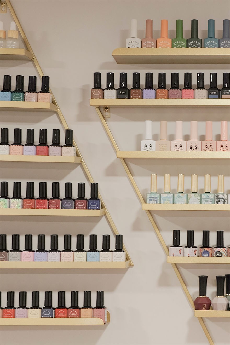 nail varnishes on the wall of hair salon