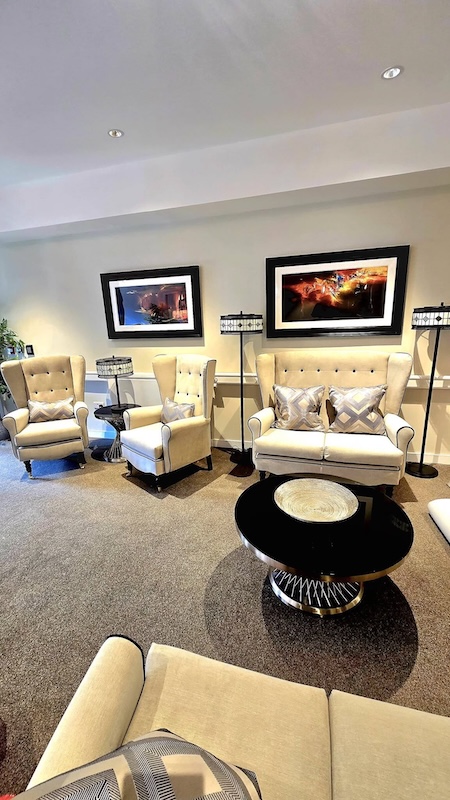 reception seating area with paintings on wall